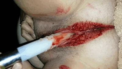 Fucking her pussy with a dildo during her period