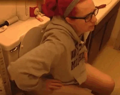 Sexy redhead nerdy babe poops at home