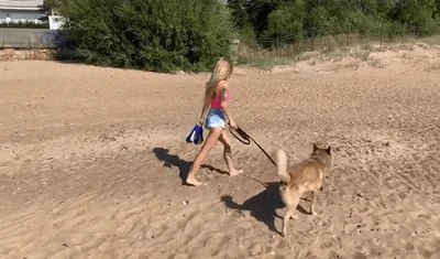 Skinny woman with tattoos having sex on the beach